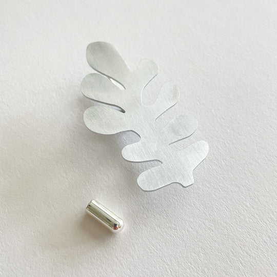 Pin Brooch in silver aluminium by Tom Pigeon