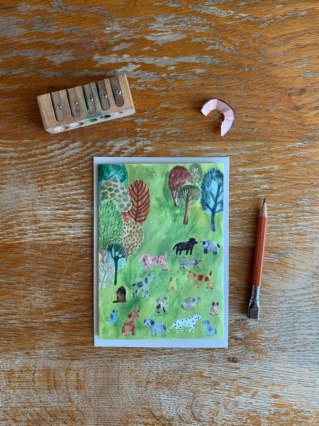 Dogs in the Park Greetings Card by Nicola Clarke